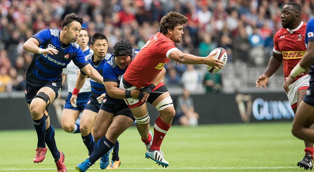 Rumball (center) playing with Rugby Canada against Japan.