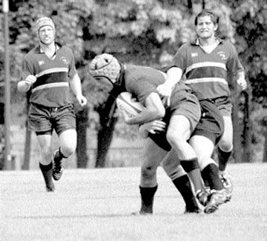 Gaels hooker Steve Orchard (left) runs in to support a teammate in a game against the Oakville Crusaders at Kingston Field on Saturday.