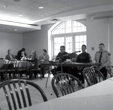 Police officers speak at a symposium Sunday hosted by Four Directions Aboriginal Centre.