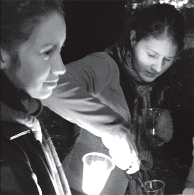 Students gather at a candlelight vigil to remember the victims of anti-transgender violence.