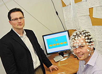 Christopher Bowie (left) and Jeremy Stewart (right) test out an electroencephalogram. Bowie was awared $74