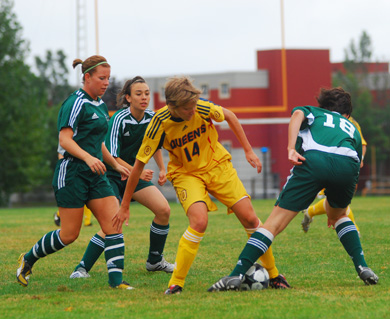 Gaels’ striker Renee MacLellan battles Trent’s Marie-Michelle Sullivan for the ball Saturday.