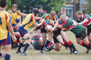 Gaels’ locks Tom Binczyk (centre) and Shane Baddeley (left) take down an Ulster player Saturday at Kingston Field.