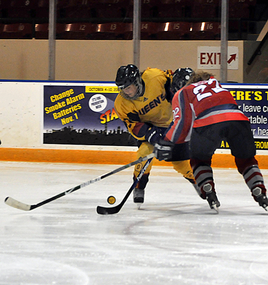 Gaels’ forward Alana Smith tries to avoid pressure from Badger forward Kristen Dewsbury.