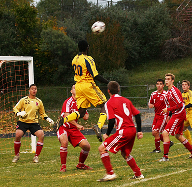Striker Remi Ojo rises for a header against Royal Military College on Wednesday night at Richardson Stadium.