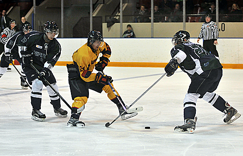 Forward Jeffery Johnstone attempts to manuever past a Nippissing defenceman at the Memorial Centre on Friday night.
