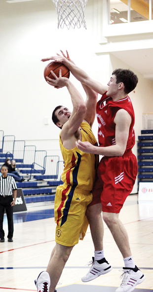 Forward Jordan Kirschberger gets his shot blocked by a Royal Military College defender in the Gaels’ win on Feb. 20. The Gaels then beat Ryerson in the first round of the playoffs before being knocked off by the Gee-Gees in the quarterfinal.