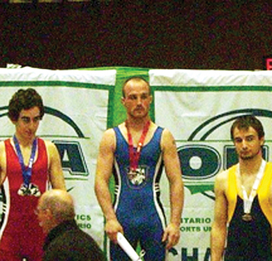 Wrestler Matt Di Staulo (right) won the OUA bronze medal in the 57-kilogram weight class two weeks ago in London.