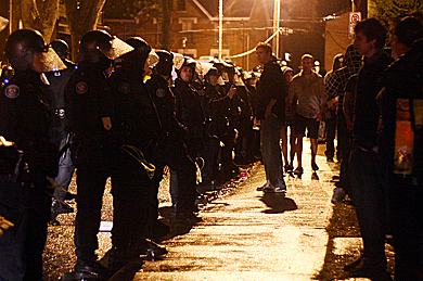 Riot police line Aberdeen Street north of William Street at about midnight.