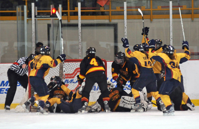 The Queen’s Gaels celebrate a goal against the Guelph Gryphons in their 2-1 win on Wednesday night. The game ended in Guelph at 1 a.m. after six overtimes.