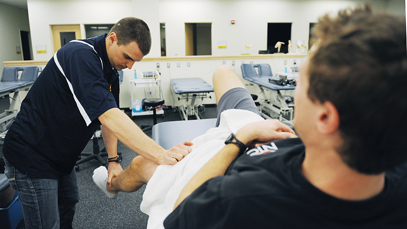 Athletic therapist James Sawchuk works on track and field athlete Shane Kelly at the Athletic Therapy department.