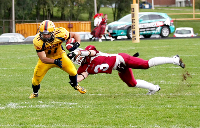 Running back Jimmy Therrien battles against the Ottawa defence in the Gaels’ 27-25 loss on Saturday at Richardson Stadium.