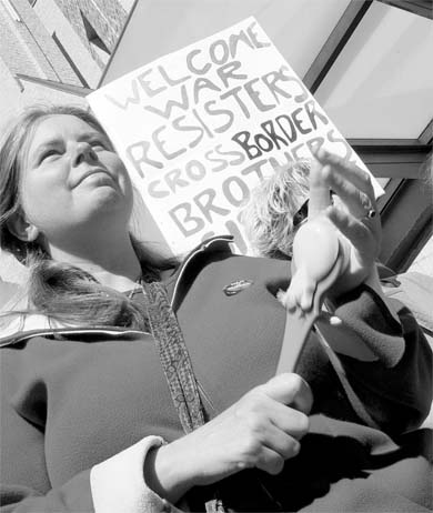 A protester shows her support at Saturday’s anti-war rally.