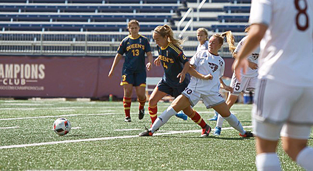 Rookie Gael Taylor Green (4) lunges towards the ball.