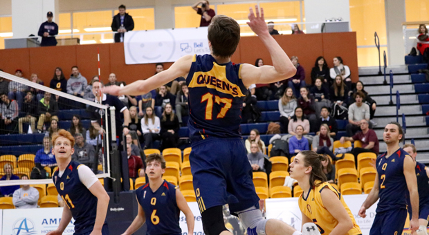 Outside hitter Mitchell Neuert (17) goes up for a spike against McMaster.