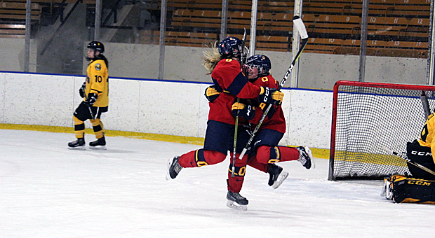 Forward Caroline DeBruin (right) celebrates after scoring the game-winning goal on Saturday night against Waterloo.