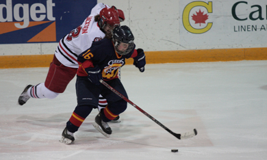Queen's forward Becky Conroy (16) tries to evade York forward Justine Jackson Saturday night at the Memorial Centre. The Gaels won 2-0.
