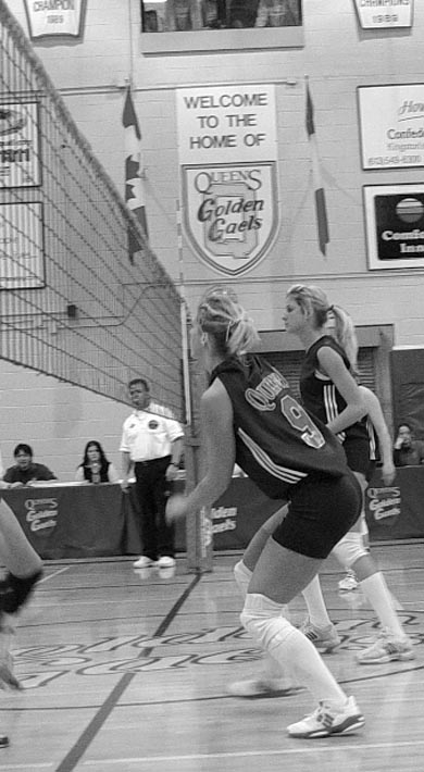 Members of the women’s volleyball team track the ball.