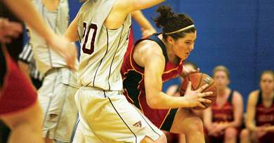 Women’s basketball point guard Teddi Firmi drives to the hoop against Ottawa guard Melina Wishart Tuesday night.