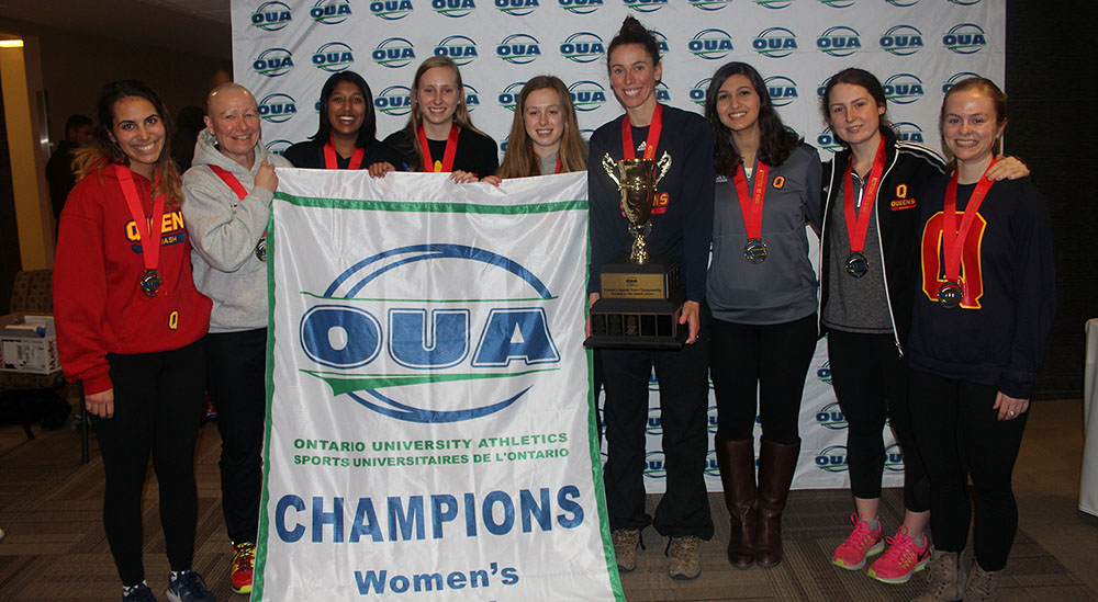 Queen’s women’s team poses with their second Ontario banner in a row.
