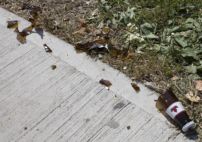 Broken bottles in the University District after a street party,